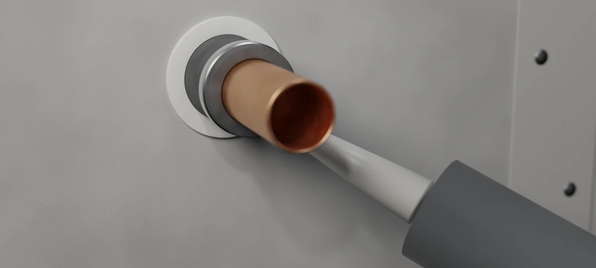 During: pipe sleeve fitted and intumescent mastic going into the annulus